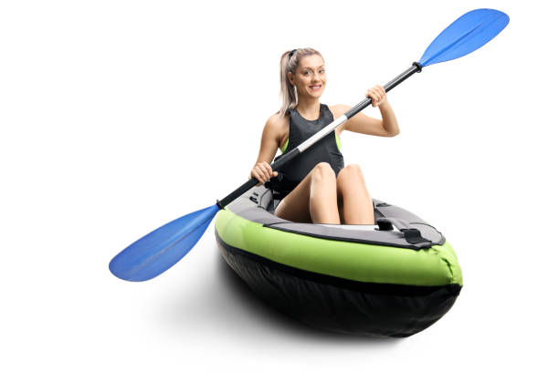 istock Young female in a canoe with paddles smiling 1181655710