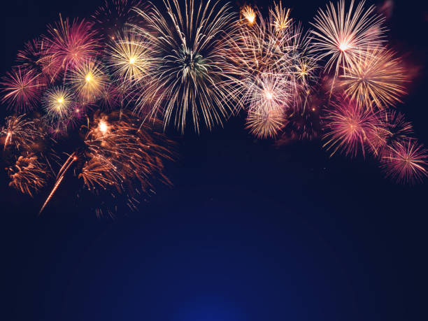 istock colorful fireworks on the black sky background with free space for text. Celebration and anniversary concept 1181655860