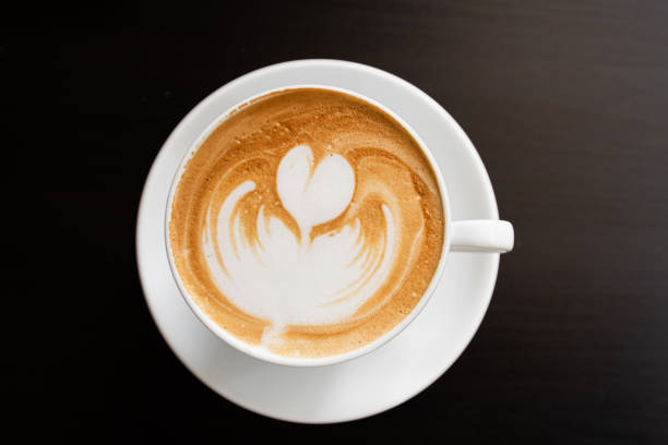 istock coffee cup on brown wooden background (coffee, top) 1181655993