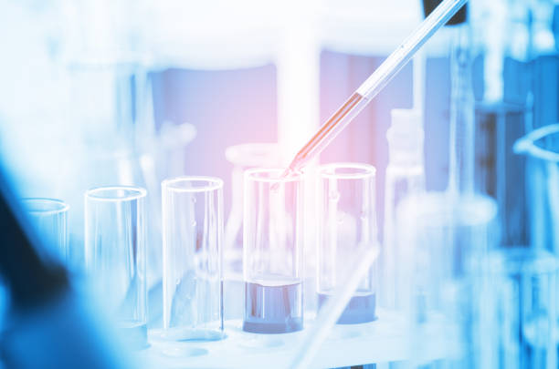 istock A pipette dropping sample into a test tube,abstract science background 1181656109