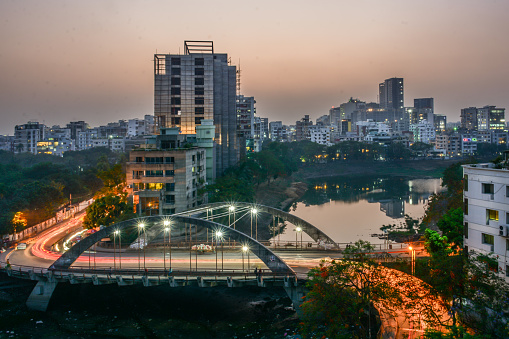 Photo of the under-construction  building and surrounding water bodies and traffic flows