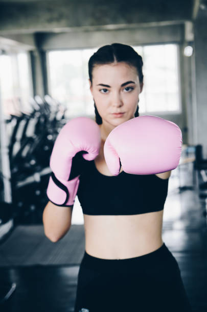 istock Attractive Female Boxer At Training in gym 1181659209