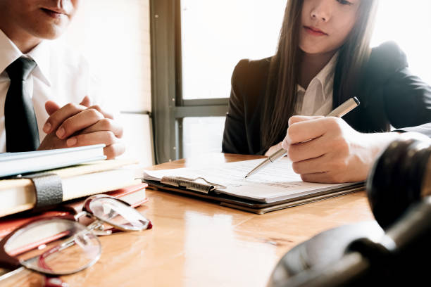 istock Close up Business People Analyzing Statistics Business Documents, Pen point at documents, Financial Concept 1181659393