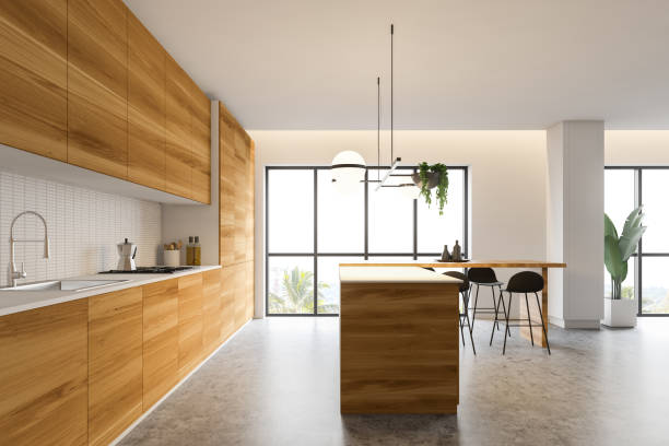istock Side view of white and wooden kitchen with bar 1181659537
