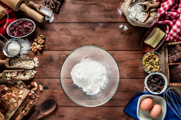 istock Chocolate and nuts cookie making on rustic table with digital food weight scale.  Christmas themes. 1181659647