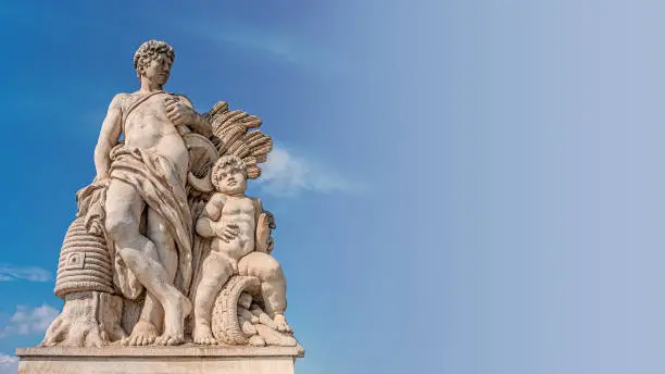 Photo of Sculpture of farmer and his scholar on Zoll Bridge in Magdeburg downtown, Germany, sunny day, blue sky