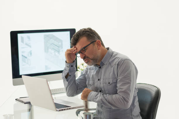 istock Tired businessman have a headache 1181660368