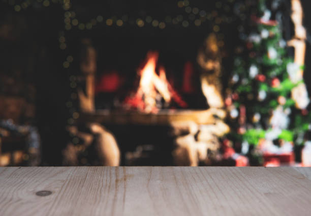 istock Wooden table with blurred christmas background 1181660488