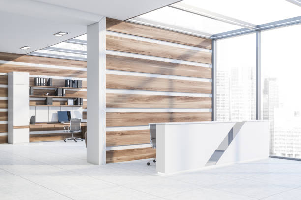 istock Reception in white and wooden office with computer 1181660787