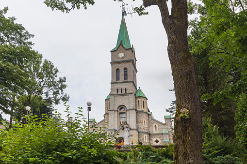 View at the bell towers of the church of the Catholic Maria Laach Abbey near Glees in Germany. The abbey dates back to the year1100 and is now a monastery of the Benedictine Confederation.