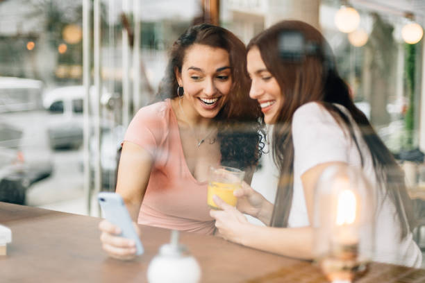 istock Girlfriends hanging out in Coffee Shop 1181664710