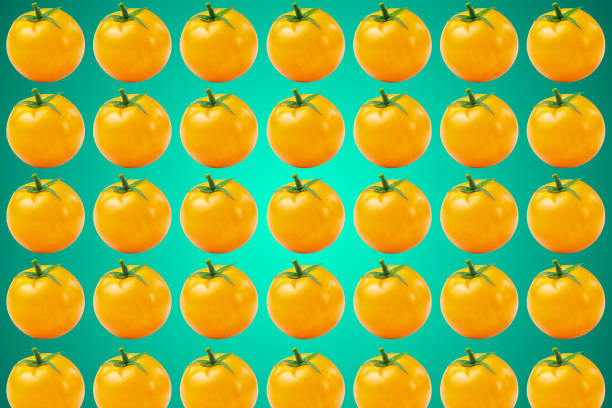 istock Vegetable pattern of yellow tomatoes on blue background. Flat lay, top view. Food background. 1181665184