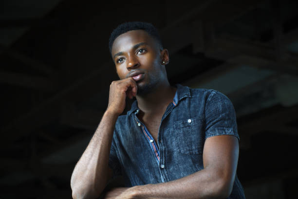 istock young man thoughtful pensive looking anxious thingking attitude 1181665345