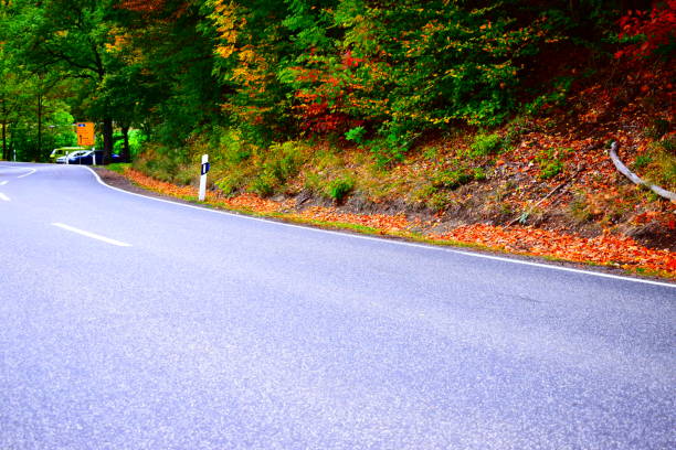 istock country road, autumn in the Eifel 1181667884
