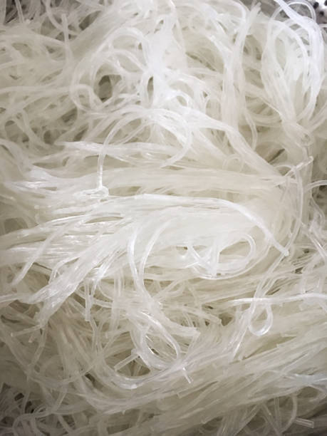 istock Thin white rice noodles. Chinese national dish. Background close-up. 1181668033