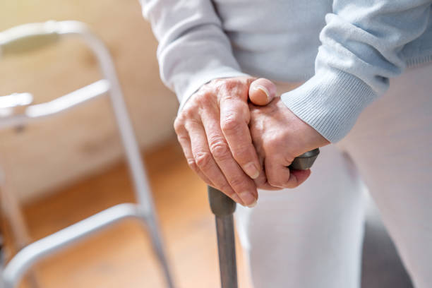 Close up of senior woman's hands holding walking stick Senior Adult, Recovery, Disability, Medicine, Patient walking stick stock pictures, royalty-free photos & images