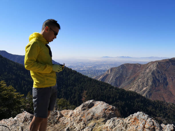 istock Asian guy eating a snack, view from Sardine Peak Trailhead 1181671003