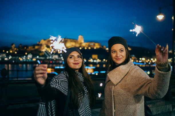 istock Young woman playing sparkler 1181673077