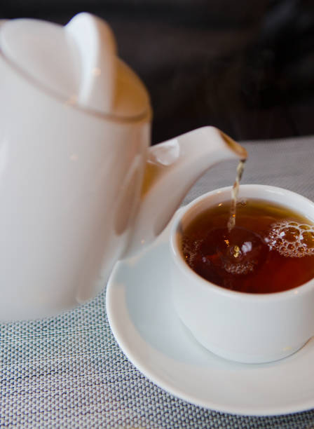 istock tea with lemon cafe white cup saucer 1181673397
