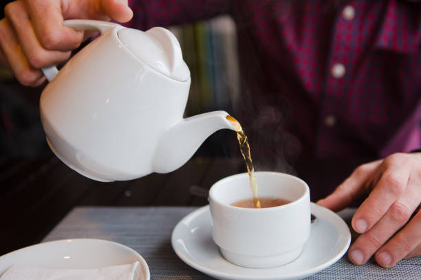 istock tea with lemon cafe white cup saucer 1181673399