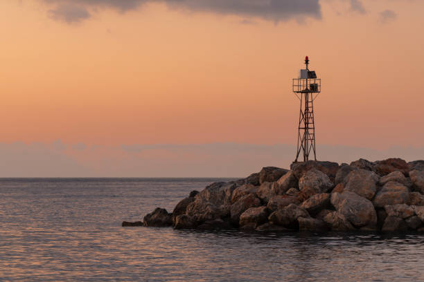 istock Mole or breakwater and the Aegean Sea at sunrise 1181675454