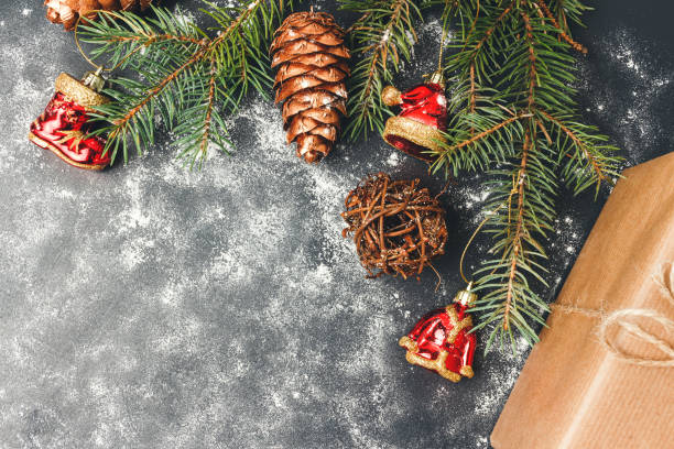 istock Christmas or New Year background with decorations, pine branch and gift box, top view with copy space 1181676713