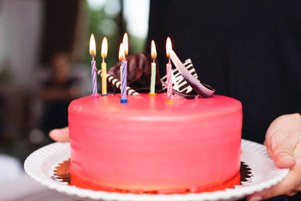 istock birthday cake and burning candles 1181681502