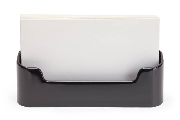 Stack of empty black business cards on white
