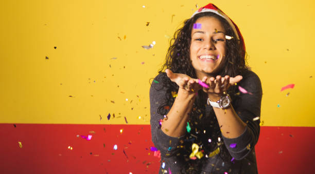 istock Woman celebrates new year with confetti 1181683193