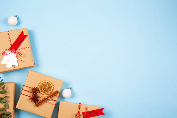 Textured background with christmas themed items in flat lay composition.
