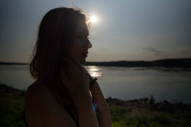 istock Silhouette of woman with sunlight 1181687397