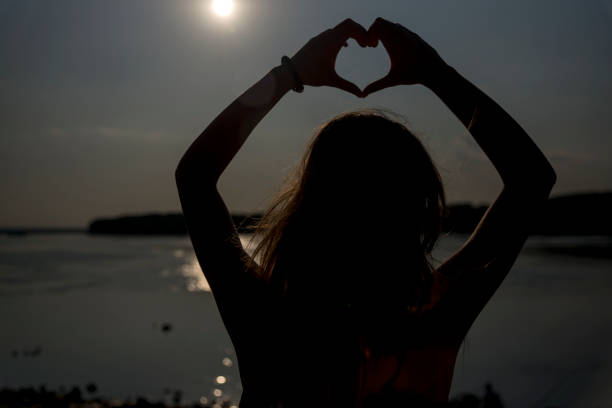 istock Silhouette of woman with sunlight 1181687406