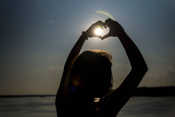 istock Silhouette of woman with sunlight 1181687426
