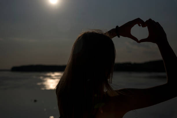 istock Silhouette of woman with sunlight 1181687448