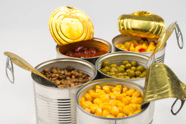 istock Canned food on white background. Green pea, beans, corn, lentils. 1181689064