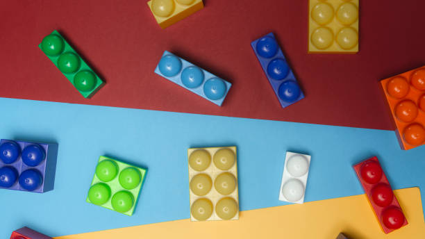 istock Toy bricks. Colorful plastic building blocks flat lay. Toys background. Child developing game. Multi-colored cubes. 1181689737
