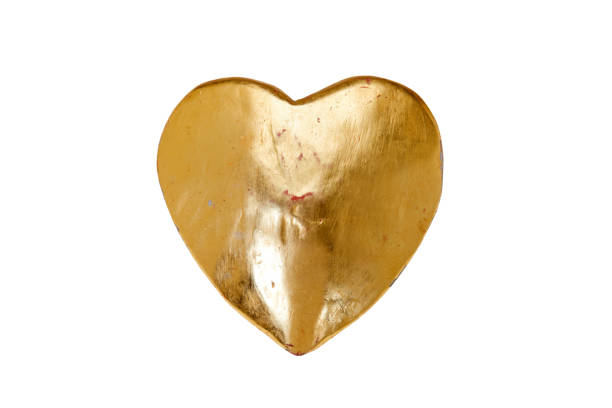 heart and particles of gold as frame on white background, copy space