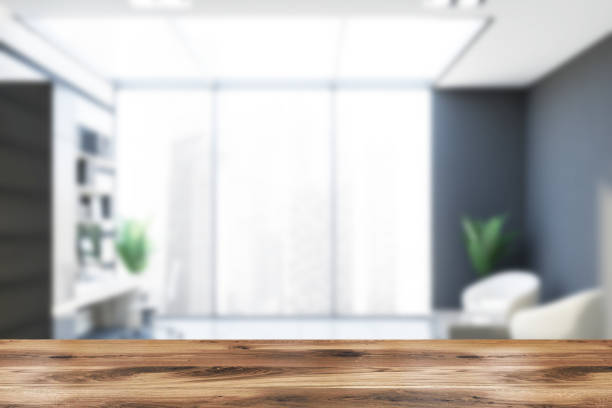 istock Blurred gray and wooden office with lounge 1181696822