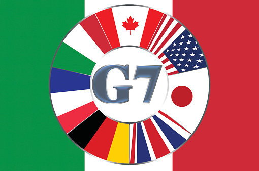 Flags included in the big seven in a circle on the background of the flag of Italy.
