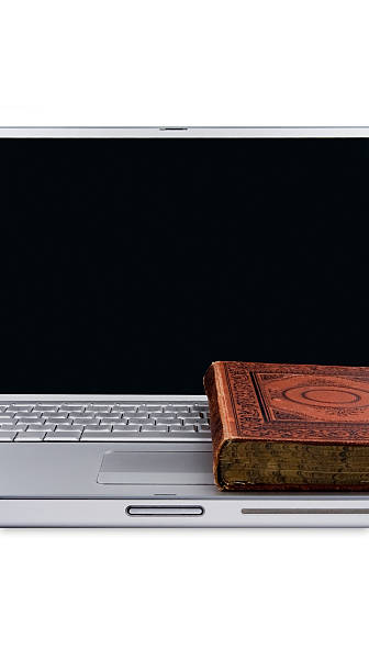 istock Antique book on a modern laptop 118169814