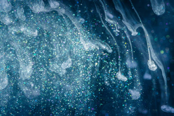 istock Acrylic ink with glitter floating in the water 1181701227