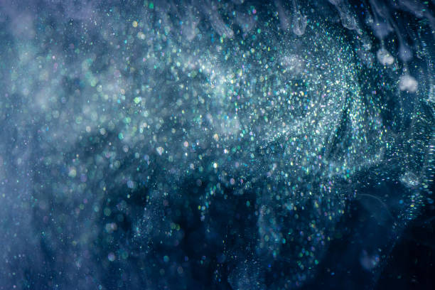 istock Acrylic ink with glitter floating in the water 1181701676
