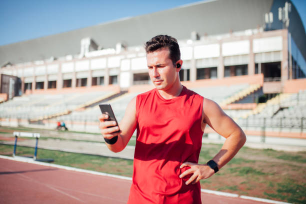 istock Man setting up smartwatch for running stock photo 1181703167