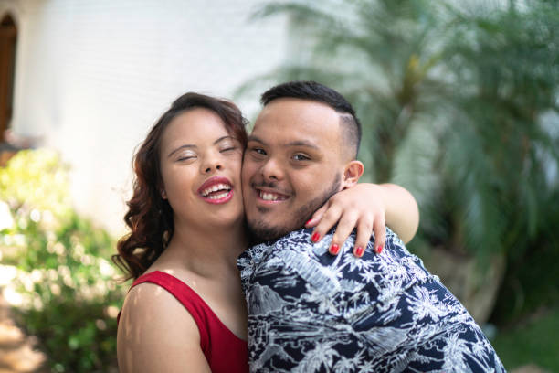 istock Portrait of special needs couple hugging 1181704334