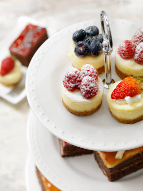 istock Afternoon Tea, Three Tier Stand of Desserts with Bite Size Cheesecakes 1181704465