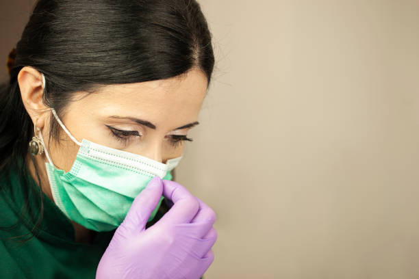 istock The dentist prepares the mask for work 1181712259