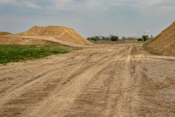 istock excavator summarizes soil on construction site in dry summer season 1181713057