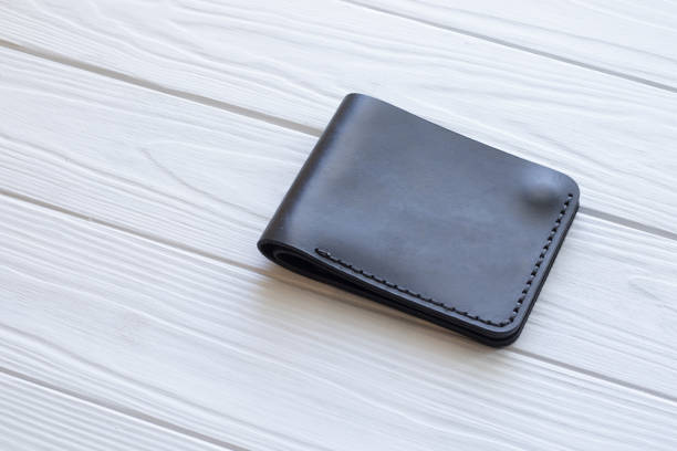 istock black leather wallet on a wooden background 1181714391