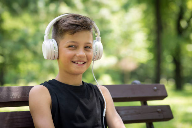 istock Smiling boy wearing headphones 1181715190