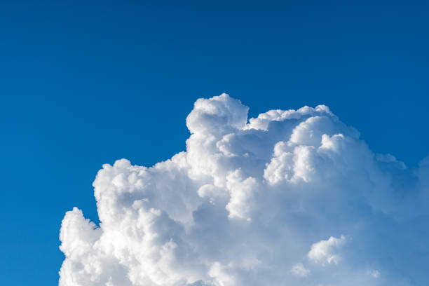 istock Blue sky white cumulus clouds before storm in summer cast shadow 1181716603